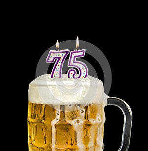 Number 75 candle in beer