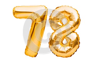 Number 78 seventy eight made of golden inflatable balloons isolated on white. Helium balloons, gold foil numbers. Party decoration