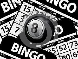 Number 8 black bingo ball over black bungo cards