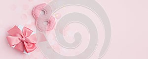Number 8 and gift box as a symbol of the holiday. Pink monochrome concept, Greeting card for 8 March Woman`s Day. Sesaonal