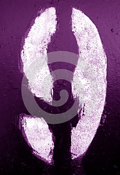 Number 9 in stencil on metal wall in purple tone