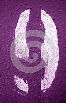 Number 9 in stencil on metal wall in purple tone