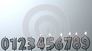 Number candles blowing out in numerical order with copy space