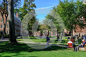 Students of prestigious Harvard University, MA, seen walking between lectures.