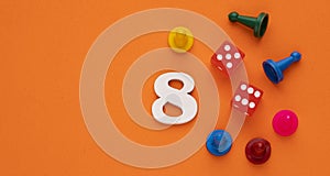 Number 8 with dice and board game pieces - Orange eva rubber background