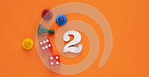 Number 2 with dice and board game pieces - Orange eva rubber background