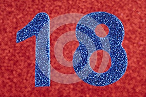 Number eighteen blue color over a red background. Anniversary.