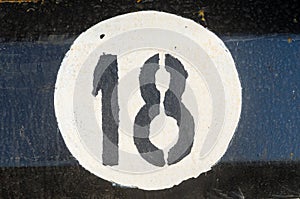 Number eighteen on the metall plate