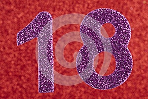 Number eighteen purple color over a red background. Anniversary