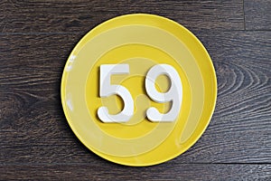 The number fifty-nine on the yellow plate.
