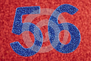Number fifty-six blue color over a red background. Anniversary.