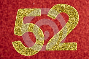 Number fifty-two yellow over a red background. Anniversary. Horizontal