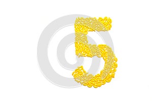 Number cinq made from banana candy photo