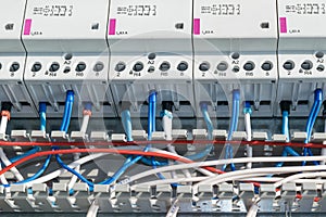 A number of modular contactors, cable channel and wire.