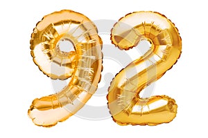 Number 92 ninety two made of golden inflatable balloons isolated on white. Helium balloons, gold foil numbers. Party decoration,