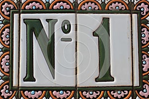 Number one 1 green white pink colorful design house number plate in Spain best winner first price win photo