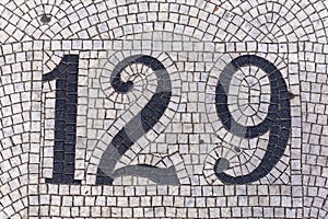 Number one hundred and twenty nine in mosaic floor