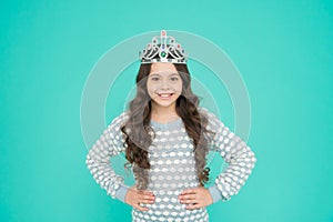 Number one. Kid wear golden crown symbol of princess. Girl cute baby wear crown blue background. Success and happiness