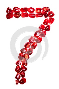 The number seven pomegranate seeds isolated on white background. photo
