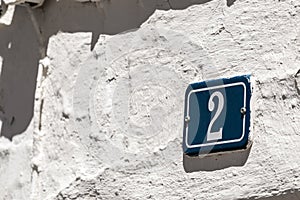 Number sign on plaster wall