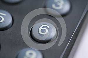 Number six button