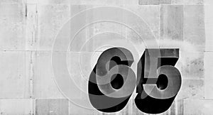 Number sixty-five on wall