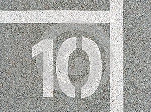 Number ten painted on soft rubber surface. The tenth place