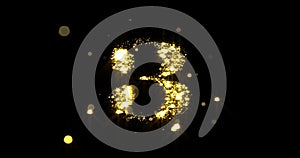 Number three glitter gold. Golden glittering number 3 with glister light and shiny sparks black background