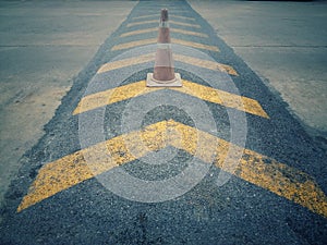 A number of traffic cones on the road