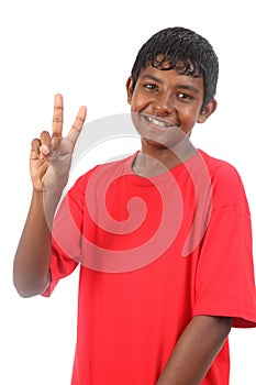 Number two signal from young smiling teenager boy