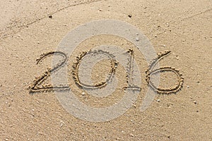 Number of year 2016 on sand