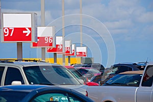 Numbered parking lot with many cars