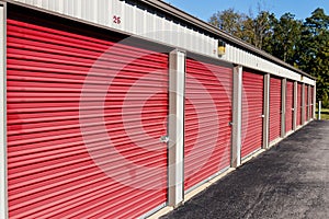 Numbered red self storage and mini storage garage units