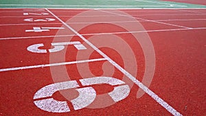 Numbering cross-country sports rubberized red track