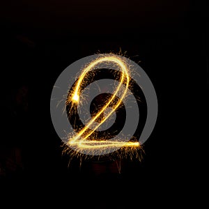 Numbers 0 to 9 created using a sparkler on black