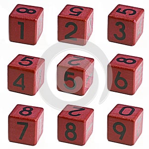 Numbers 1-2-3-4-5-6-7-8-9, one, two, three, four, five, six, seven, eight, ninewritten on a red wooden cube of a calendar date