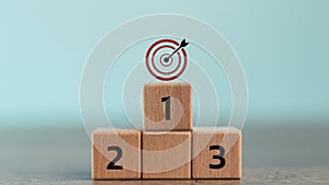 Numbers 1,2, 3 of wooden building blocks. Ranking, business strategy, leader market, competitive advantage, benchmarking concept.