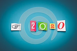 Numbers - 2020. Cut number on blue background. Banner, card. Date of calendar, new year coming. Colorful cut numbers of paper.