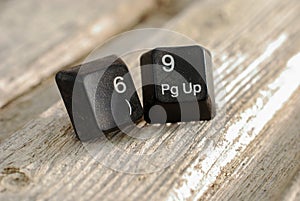 numbers 69 computer keyboard buttons on old wood background