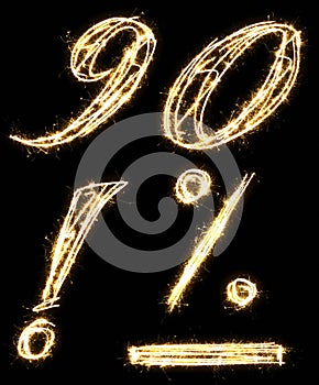 Numbers 9, 0, exclamation mark, percent and minus sign made of sparkler. Isolated on a black background.