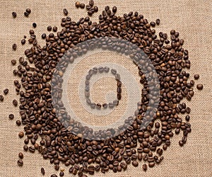 Numbers from coffee beans on burlap background