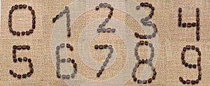 Numbers collage from coffee beans on burlap background