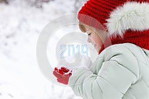 The numbers of coming year in child`s hands