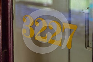 numbers on a glass door on a train