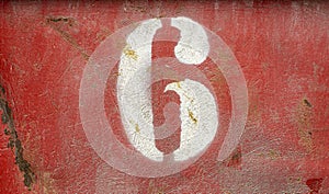 Numbers on an old rusty metal background. Texture of old paint and rust on the numbers