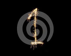 Numbers 1 or one Sparkler firework light isolated on black background
