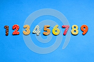 numbers from one to nine one on blue paper background.