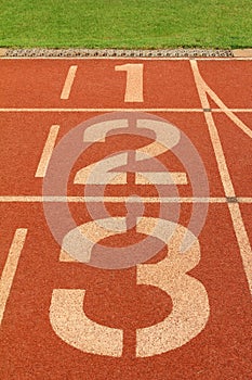 A Numbers one two and three on running track