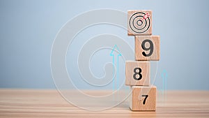 Numbers sequencing almost reaching goals and achievements on wooden blocks. Startup concept. Business concept. Management concept