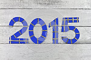 2015 numbers on silver painted clapboard